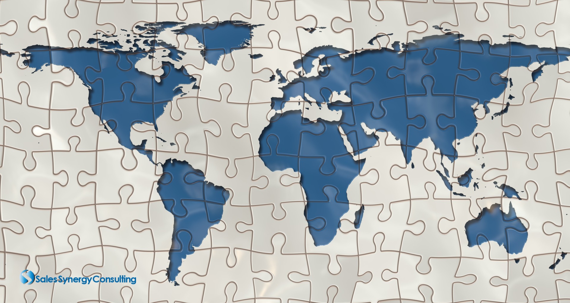 Blue-and-white map of the world made into a puzzle